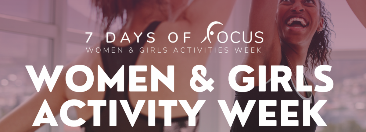 Photo of women and girls sharing a high five at a fitness class. 7 days of Focus. Women and Girls Activity Week 